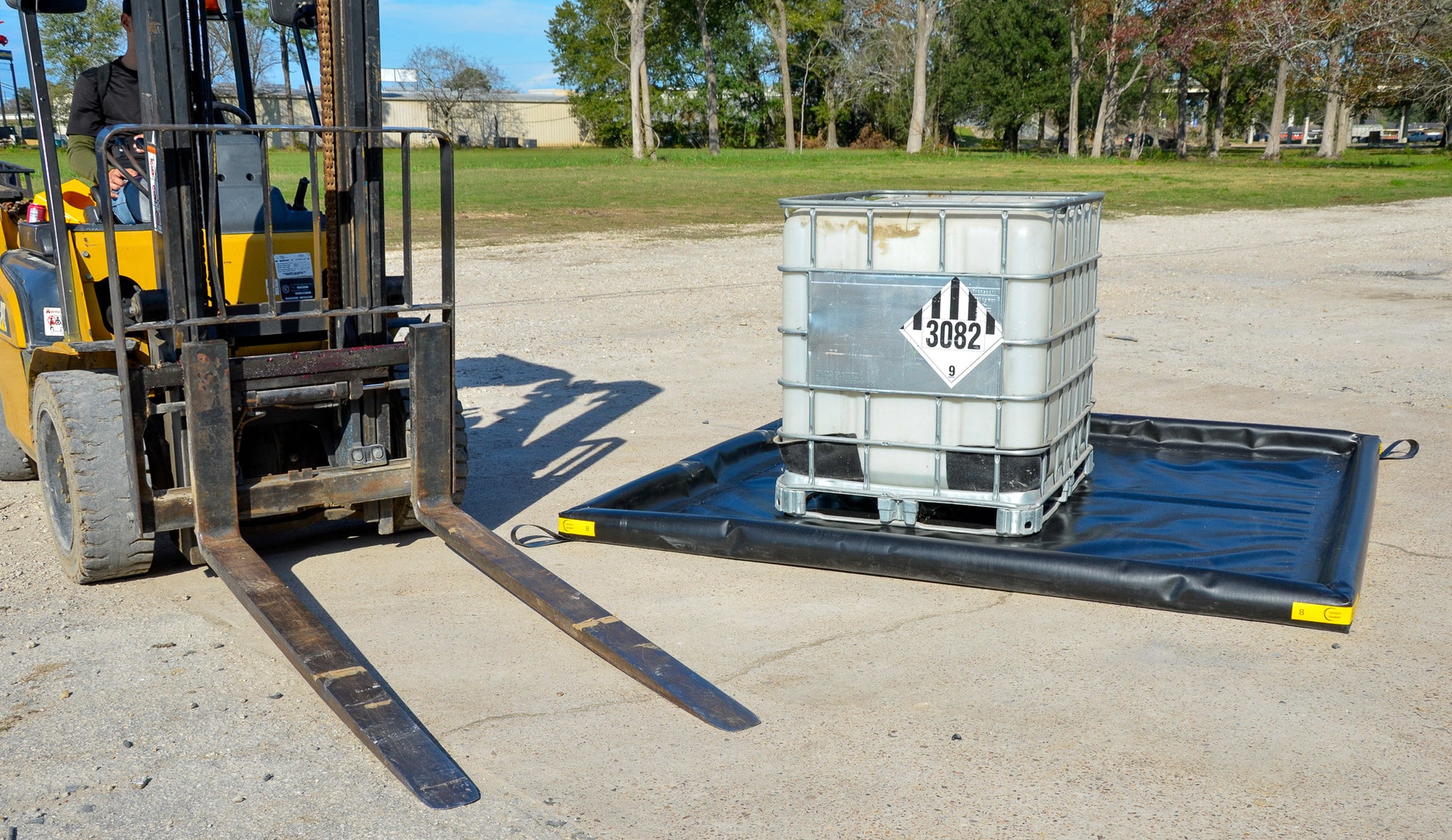 Guy on forklift set large container on DURAFLEX DRIVE OVER FOAM WALL BERM