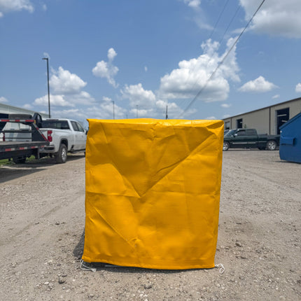 Yellow UV-Resistant Tote Cover for industrial Weather Protection in use.
