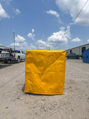 Yellow UV-Resistant Tote Cover for industrial Weather Protection in use.