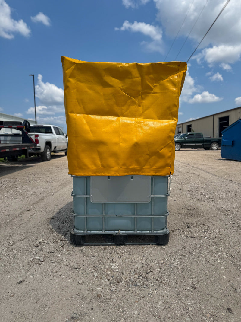 Yellow Heavy Duty Tote cover on a large blue container outdoors with a clear sky.