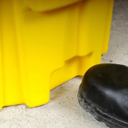Yellow Ultra-Overpack Plus with a black boot next to it