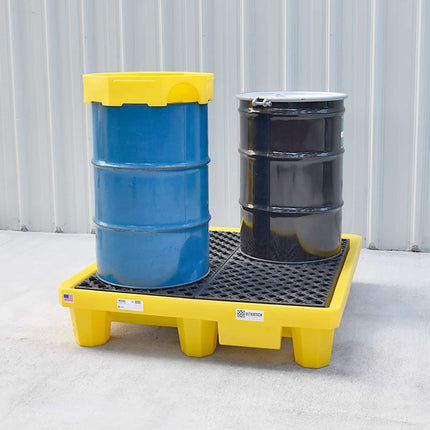 Ultra-Spill Pallet with a blue drum and black drum sitting on it.