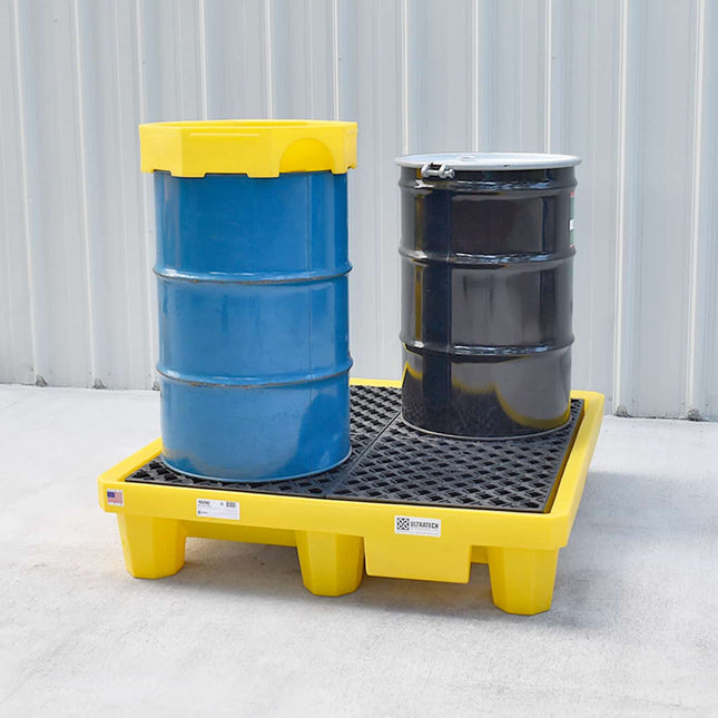 Ultra-Spill Pallet with a blue drum and black drum sitting on it.