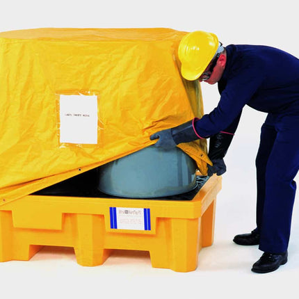 Ultra-Spill Pallet with drums on it being covered by a a man in a yellow hardhat. 