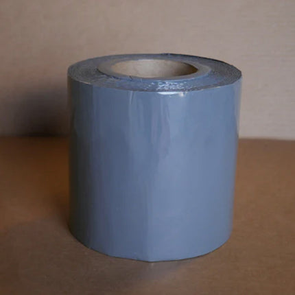 A roll of gray 6 inch berm tape 