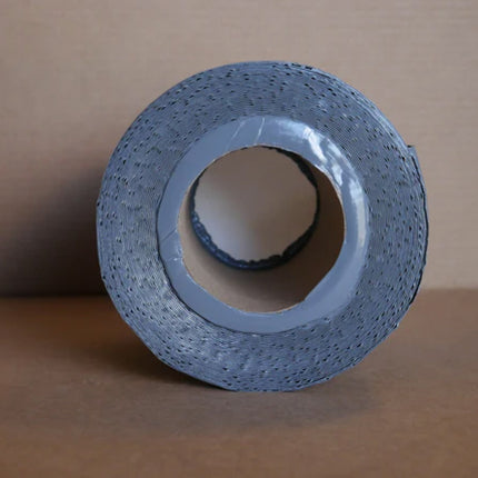 The top of a roll of gray 6 inch berm tape