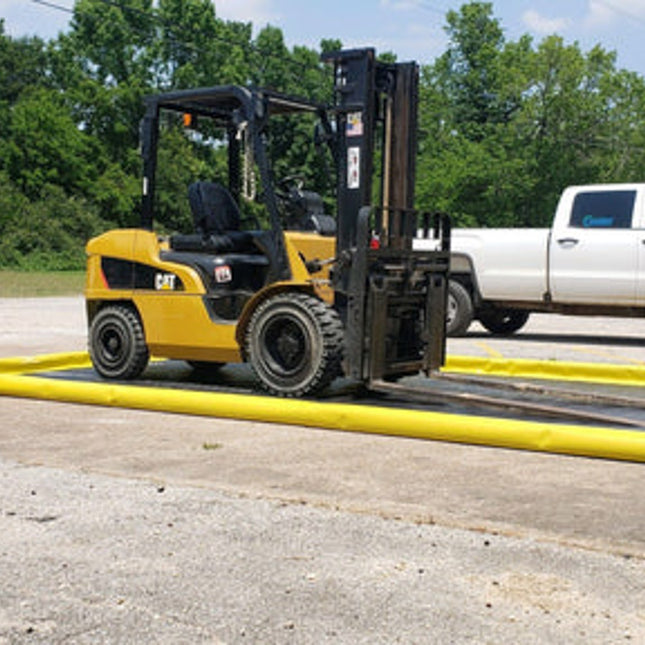 A ProFlex Foam Wall berm with a forklift on it and a rolled up ProFlex foam wall berm