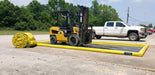 A ProFlex Foam Wall berm with a forklift on it and a rolled up ProFlex foam wall berm