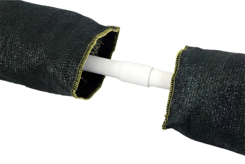 The inside of a Spill Bully Curb Inlet filter with white pipe and fabric over it