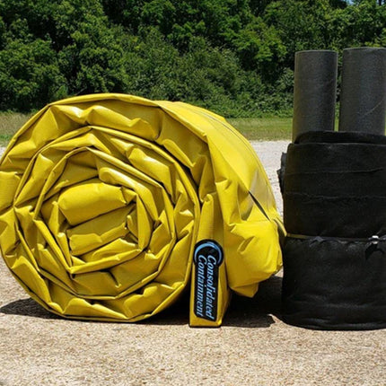 A ProFlex Foam Wall Berm with track guards rolled up next to it