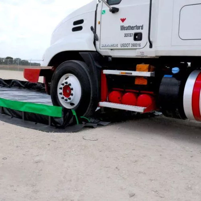 An 18 wheeler drives into an Ultra-Containment Berm Ultimate Model