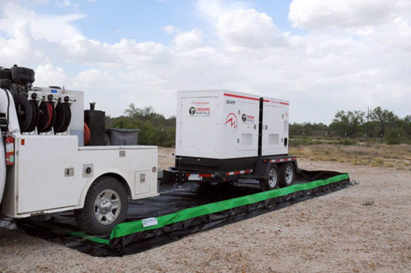 A work truck backing a mini-trailer into a Ultra-Collapsible Berm