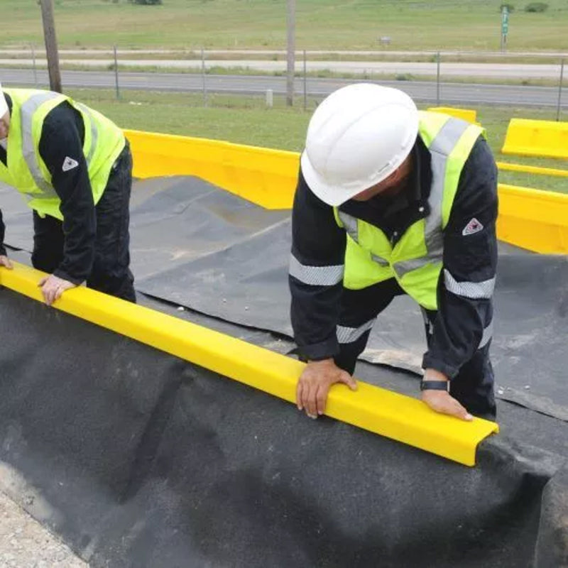 Men installing an Ultra Containment Wall
