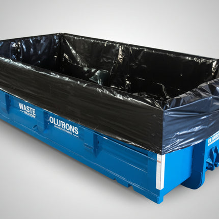 An large orange dumpster with a black liner in it